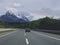 GERMANY, Bavaria, May 5, 2019: View of driver car window looking at cars on German Highway with view on mountain snow