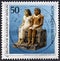 GERMANY, Berlin - CIRCA 1984: A postmark Germany shows Egyptian Couple Ehepaar aus der nekropole Giza, 300 B.C, circa