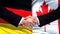 Germany and Canada handshake, international friendship relations flag background