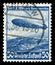 GERMANY - CIRCA 1936: German historical stamp:  mesatlantica flights L. Z. 129 airship `Hindenburg` over the Atlantic ocean with