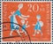 GERMANY - CIRCA 1957: This postage stamp in green shows mother with child who welcomes child with backpack. Recreation places for