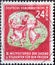 GERMANY, DDR - CIRCA 1951 : a postage stamp from Germany, GDR showing a folk dance group. III. World Festival of Youth and Student