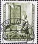 GERMANY, DDR - CIRCA 1955  : a postage stamp from Germany, GDR showing Girl reading a letter at the window by Jan Vermeer van Delf