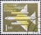 GERMANY, DDR - CIRCA 1957  : a postage stamp from Germany, GDR showing a stylized jet aircraft to the left top view without a co