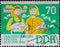 GERMANY, DDR - CIRCA 1964 : a postage stamp from Germany, GDR showing two cattle breeders with headscarves, pigs in front of pig f