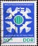 GERMANY, DDR - CIRCA 1965  : a postage stamp from Germany, GDR showing some peace doves around earth globe, flag of Finland. World