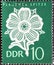 GERMANY, DDR - CIRCA 1966  : a postage stamp from Germany, GDR showing the handcrafted Plauen lace: flower pattern. green