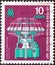 GERMANY, DDR - CIRCA 1967 : a postage stamp from Germany, GDR showing a circular knitting machine `Multilock`, trade fair symbol