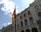 Germany flag before facade of Five Continents Museum in Munich on sunny day