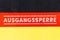 Germany flag with german text ausgangssperre, in english curfew