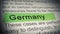 Germany. Highlighter pen marks word in Newspaper. Closeup.