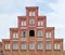 Germany. LÃ¼neburg. Gothic stepped gable of medieval building in the square Am Sande on blue sky background