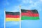 Germany and Malawi two flags on flagpoles and blue cloudy sky