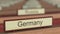 Germany name sign among different countries plaques at international organization. 3D rendering