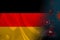 Germany national flag on silk  background coronavirus  tourism concept  state border quarantine measures  vaccination against