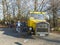 GERMANY, SACHSEN, OCTOBER 16,2019: Old retro yellow touristic bus on Hochwald hill lookout with group of german tourist. Sunny