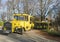 GERMANY, SACHSEN, OCTOBER 16,2019: Old retro yellow touristic bus on Hochwald hill lookout with group of german tourist. Sunny
