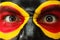 Germany sports fan patriot. Painted country flag on angry man face. Devil Eyes close up