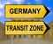 Germany and Transit zone traffic sign with blurred Berlin background