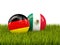 Germany vs Mexico. Soccer concept. Footballs with flags on green