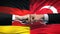 Germany vs Turkey conflict, international relations, fists on flag background