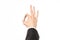 Gestures and Business theme: businessman shows hand gestures with a first-person in a black suit on a white background isolated