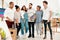 We get along so well. Full length shot of a diverse group of artists standing together during an art class in the studio