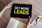 Get more leads banner. Digital marketing and sales increase concept on device screen.