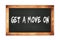 GET  A  MOVE  ON text written on wooden frame school blackboard