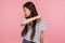 Get out, leave me! Portrait of irritated dissatisfied brunette girl in striped t-shirt showing way out, ordering to go away