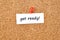 Get ready. Text written on a piece of paper, cork board background