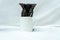 Get ready to be charmed by this small black kitten\\\'s playful spirit and energy while playing around a white blank mug