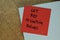 Get Rid Of limiting Beliefs write on sticky notes isolated on Brown burlap laying on table