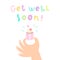 Get well soon. Hand holding a cupcake.