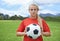 Getting focused for the game. Portrait of a determined young female soccer player standing on the pitch.