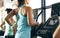 Getting into full flow. Rearview shot of two unrecognizable young women working out on treadmills in the gym.