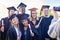 Getting a group photo of everyone. students on graduation day from university.