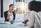 Getting her point across clearly. two businesswomen having a discussion in an office.