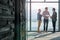 Getting organized before the presentation. Shot of male coworkers talking while standing in front of a window in an