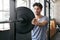 Getting psyched for his lift. a young man about to work out with weights in the gym.