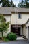 Getting ready for fall home maintenance, tall aluminum extension ladder against a two-story house