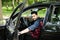 Getting ready. Portrait of young indian handsome man opening his car