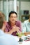 Getting serious about business. a group of businesspeople talking together around a table in an office.