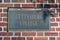 The Gettysburg College sign imbedded in a brick wall on campus