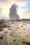 Geyser fountain discharges water at Strokkur Geysir, Iceland located at the golden circle route