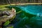 Geyser lake with clear cyan water