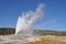 Geyser and rainbow