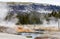 Geysers Create Waterfalls Into The Firehole River