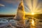 Geysir geyser and a fantastic sunset in the Icelandic winter