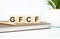 gfcf word written on wooden cubes with copy space